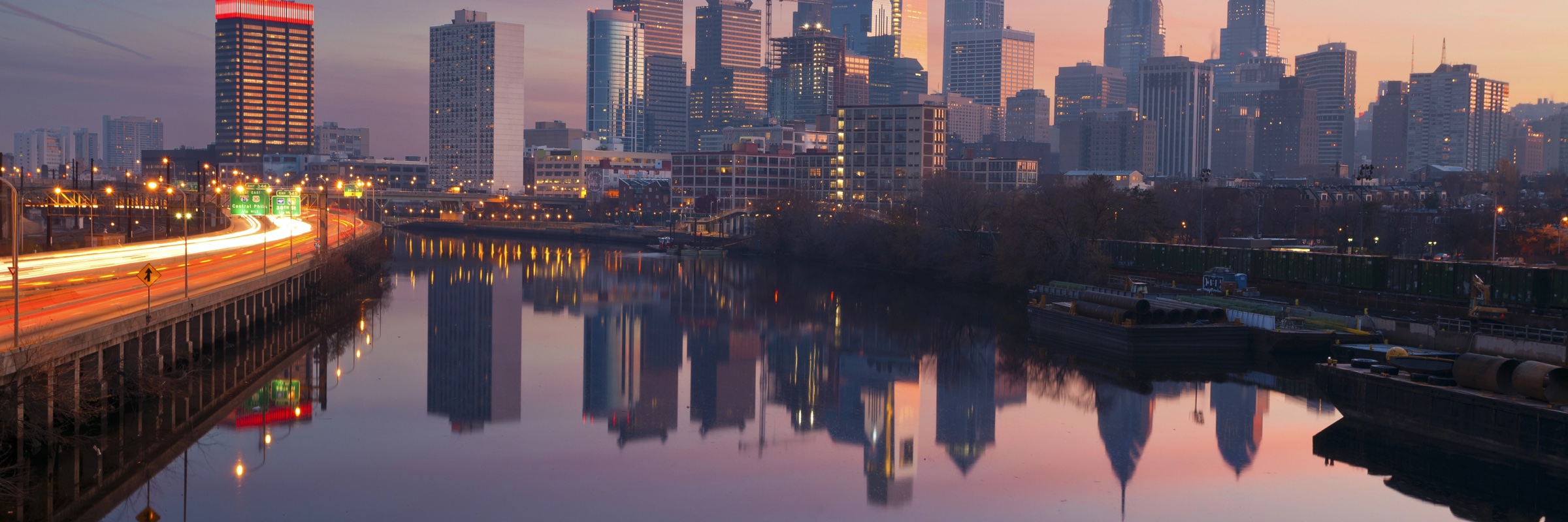 The Philadelphia skyline reflected in the Schuylkill River at dusk